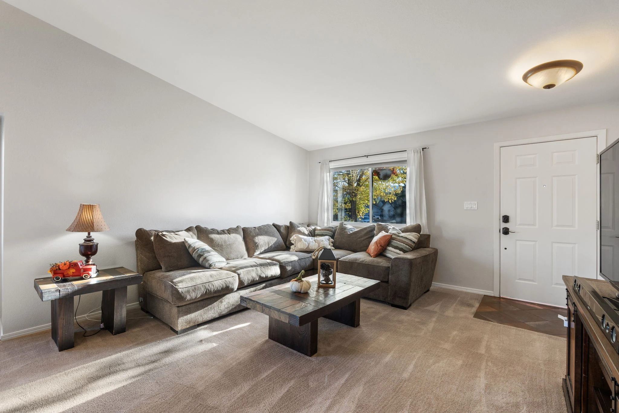 Front living room with vaulted ceiling